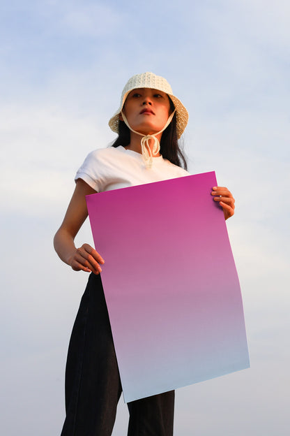 realistic poster mockup with person holding print outdoor minimal sky scene