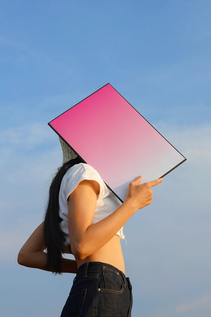 minimal poster mockup on model with clean sky backdrop and soft natural lighting