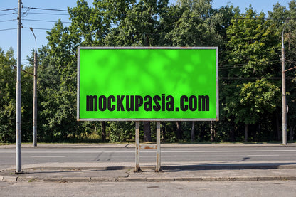 urban roadside billboard mockup with metal frame and forest backdrop in daylight