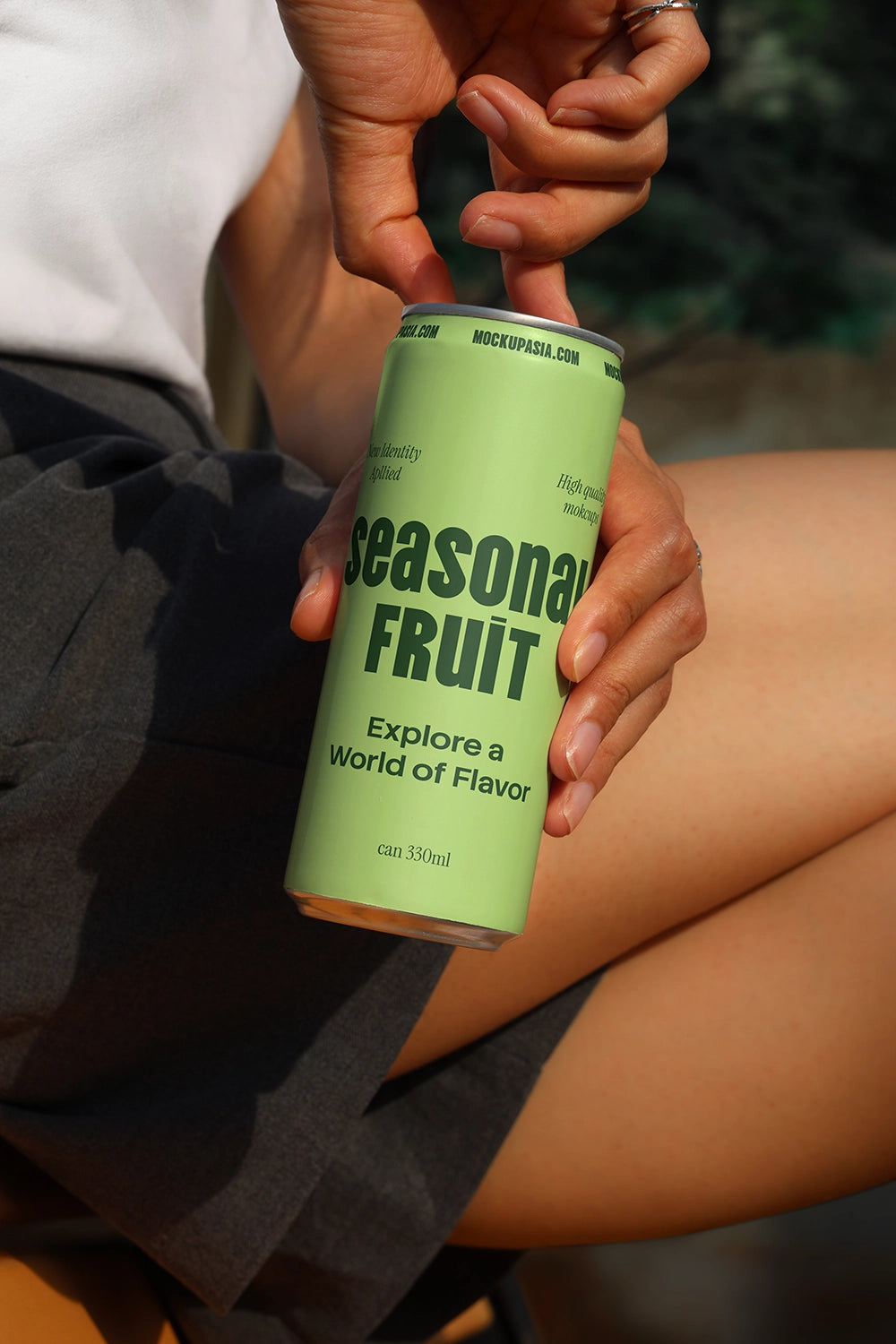 Aluminum beverage can mockup with interactive hand detail for realistic packaging presentation