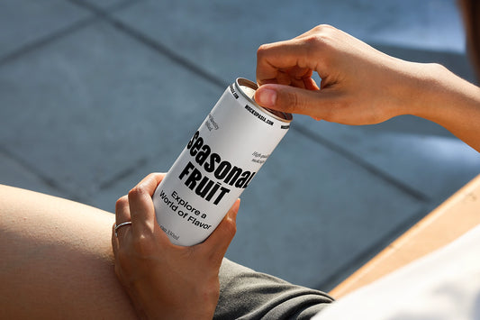 Soda can mockup with hand opening pull tab in realistic outdoor lifestyle setting