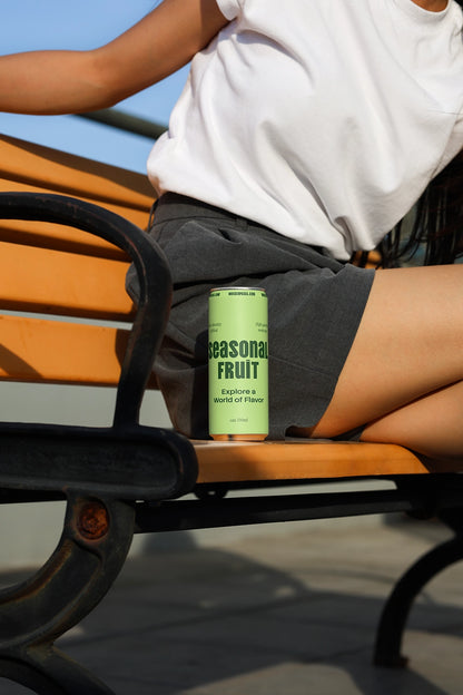 Aluminum beverage can mockup on outdoor bench with clean composition for soda and energy drink branding
