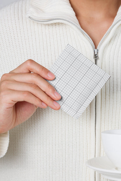 single-use sachet mockup in hand with minimal aesthetic and realistic detail