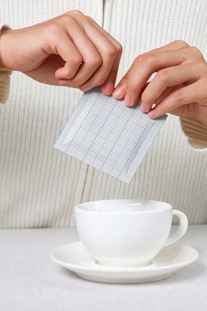 sachet mockup in use with cup and hands demonstrating product application