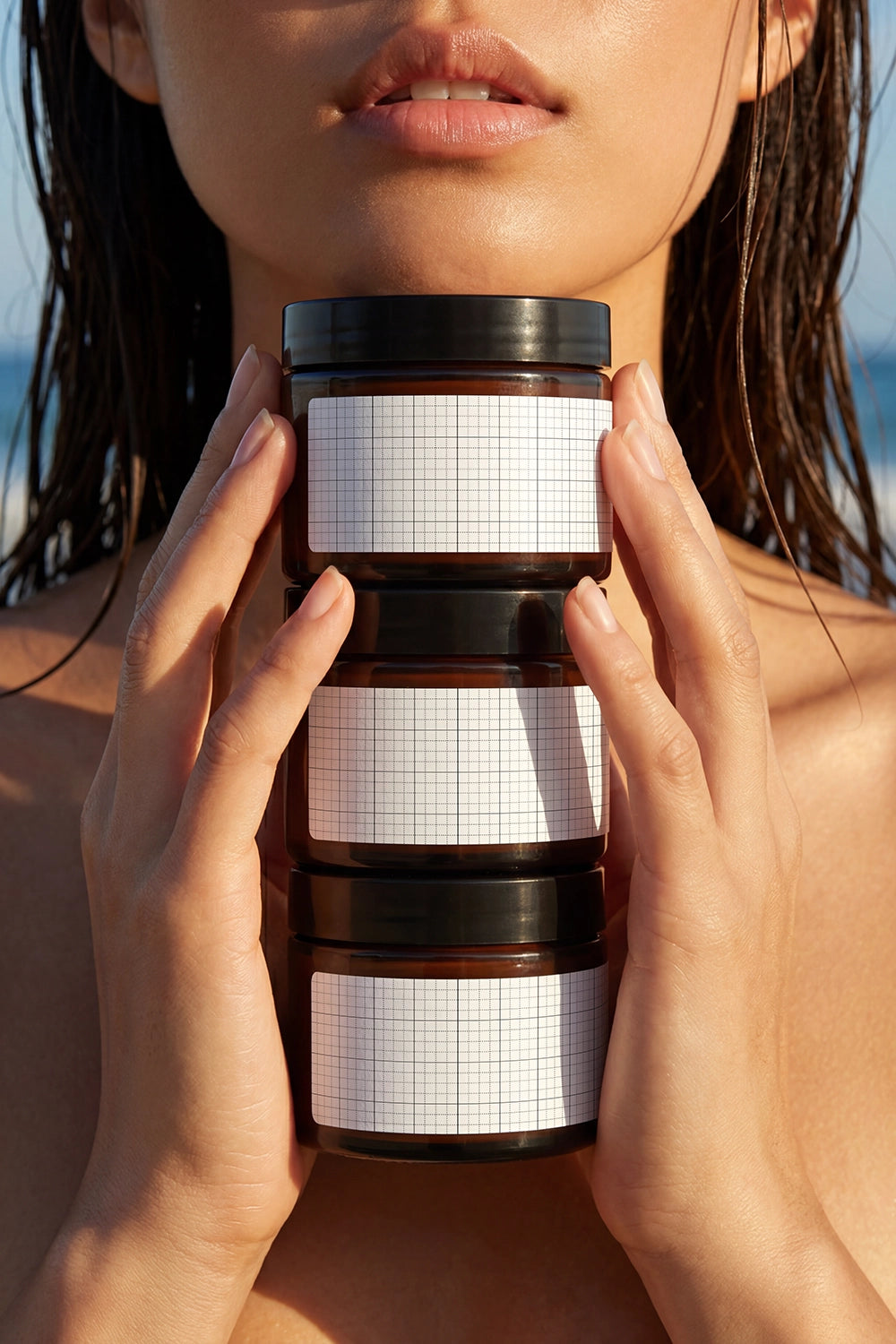 Premium skincare packaging mockup showcasing three cosmetic jars in portrait composition.