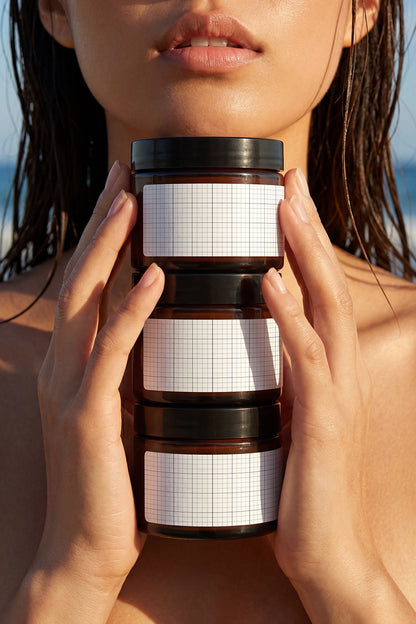 Premium skincare packaging mockup showcasing three cosmetic jars in portrait composition.