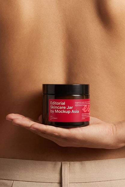 Hand-held cosmetic jar mockup for beauty packaging branding.