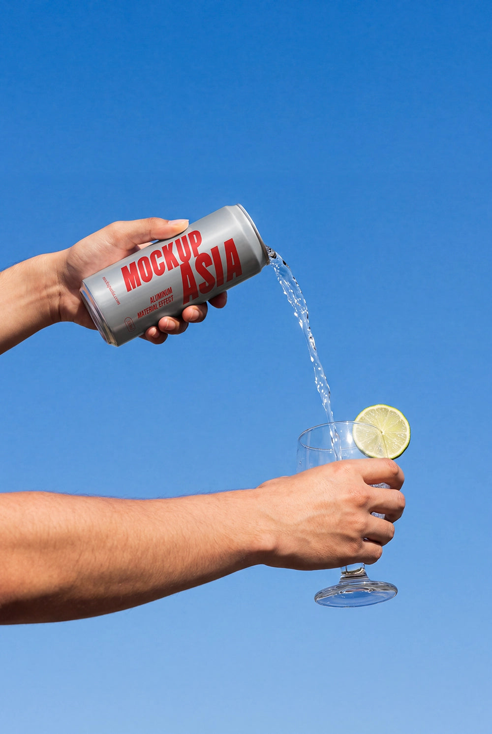 Aluminum can mockup pouring a beverage into a cocktail glass