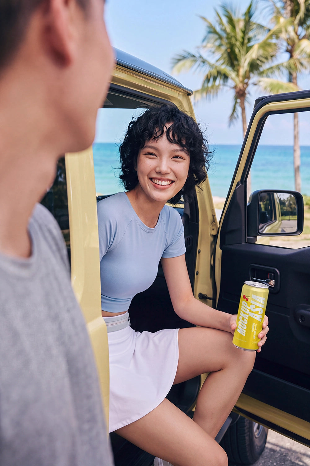 Beverage can PSD mockup in a sunny summer road trip scene