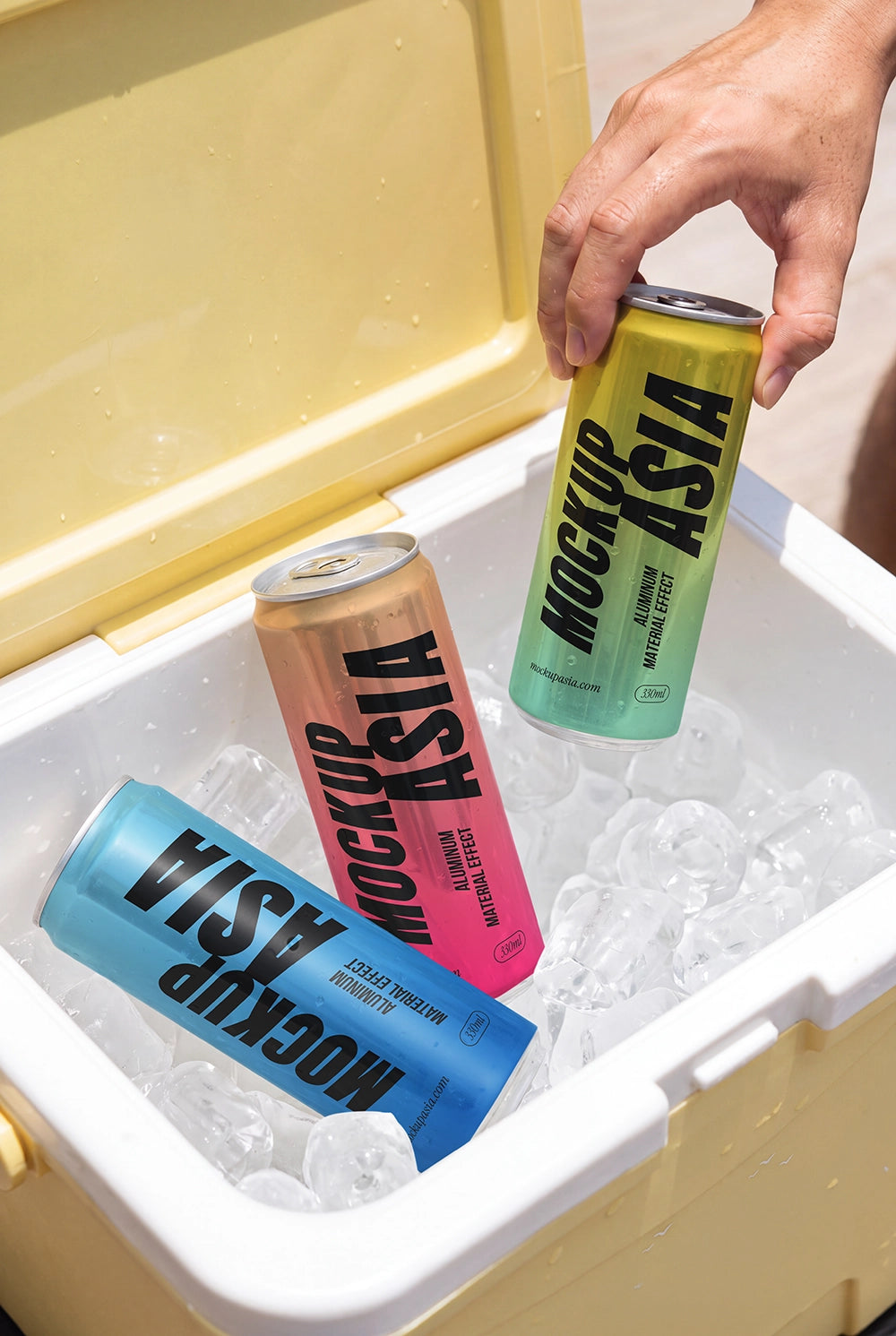 Sleek metallic can mockup surrounded by ice inside a summer cooler