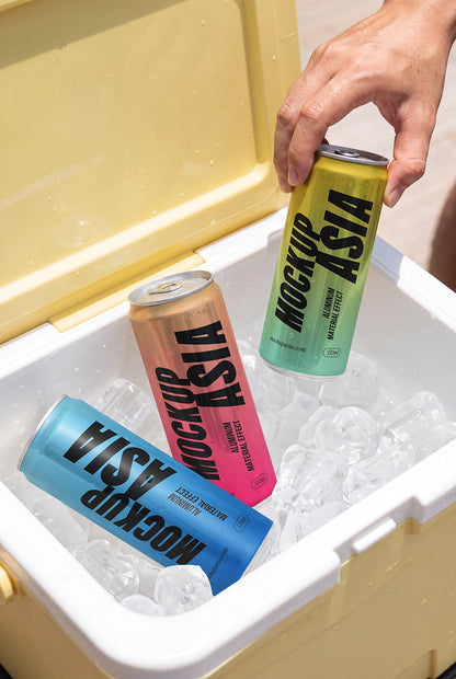 Sleek metallic can mockup surrounded by ice inside a summer cooler