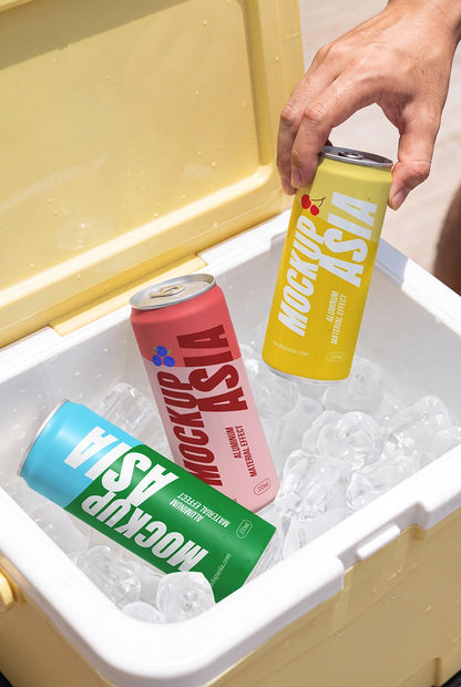 Aluminum can PSD mockup with hand lifting a chilled beverage can