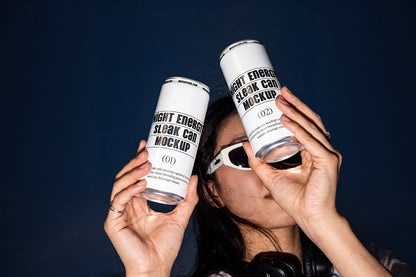 Two sleek aluminum cans held by a model in a direct flash lifestyle mockup.