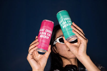 Aluminum drink can mockup with model wearing white sunglasses against a dark background.