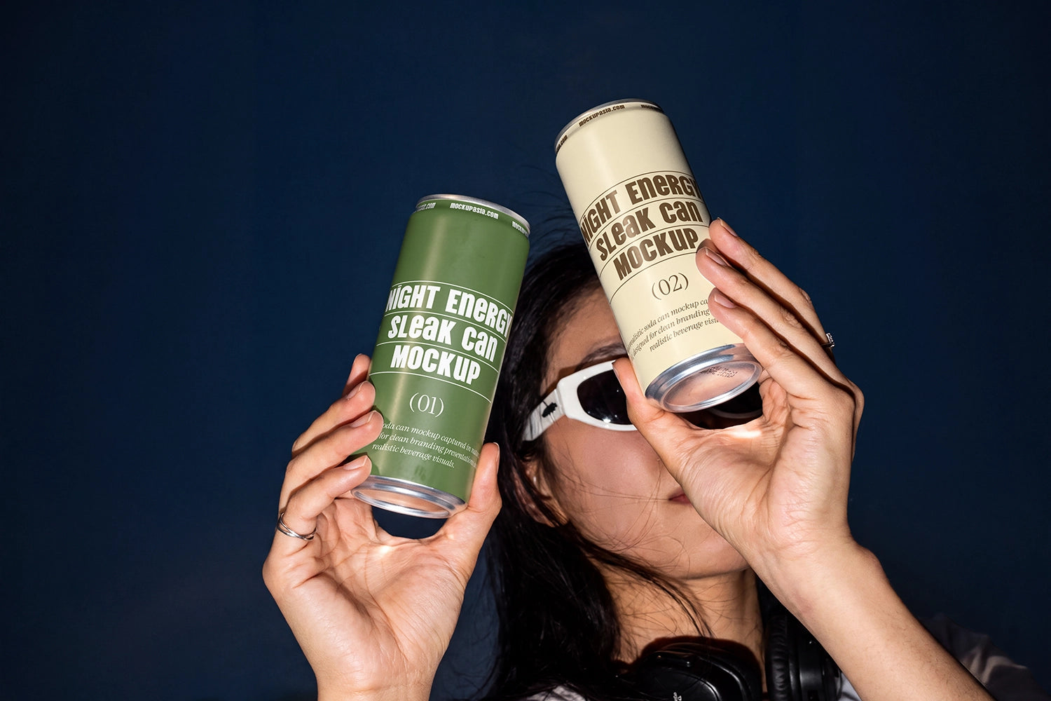 Lifestyle beverage packaging mockup with two slim cans and bold flash lighting.