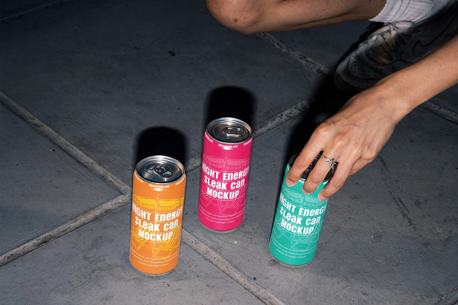 Urban lifestyle beverage mockup with sleek cans and strong cast shadows.