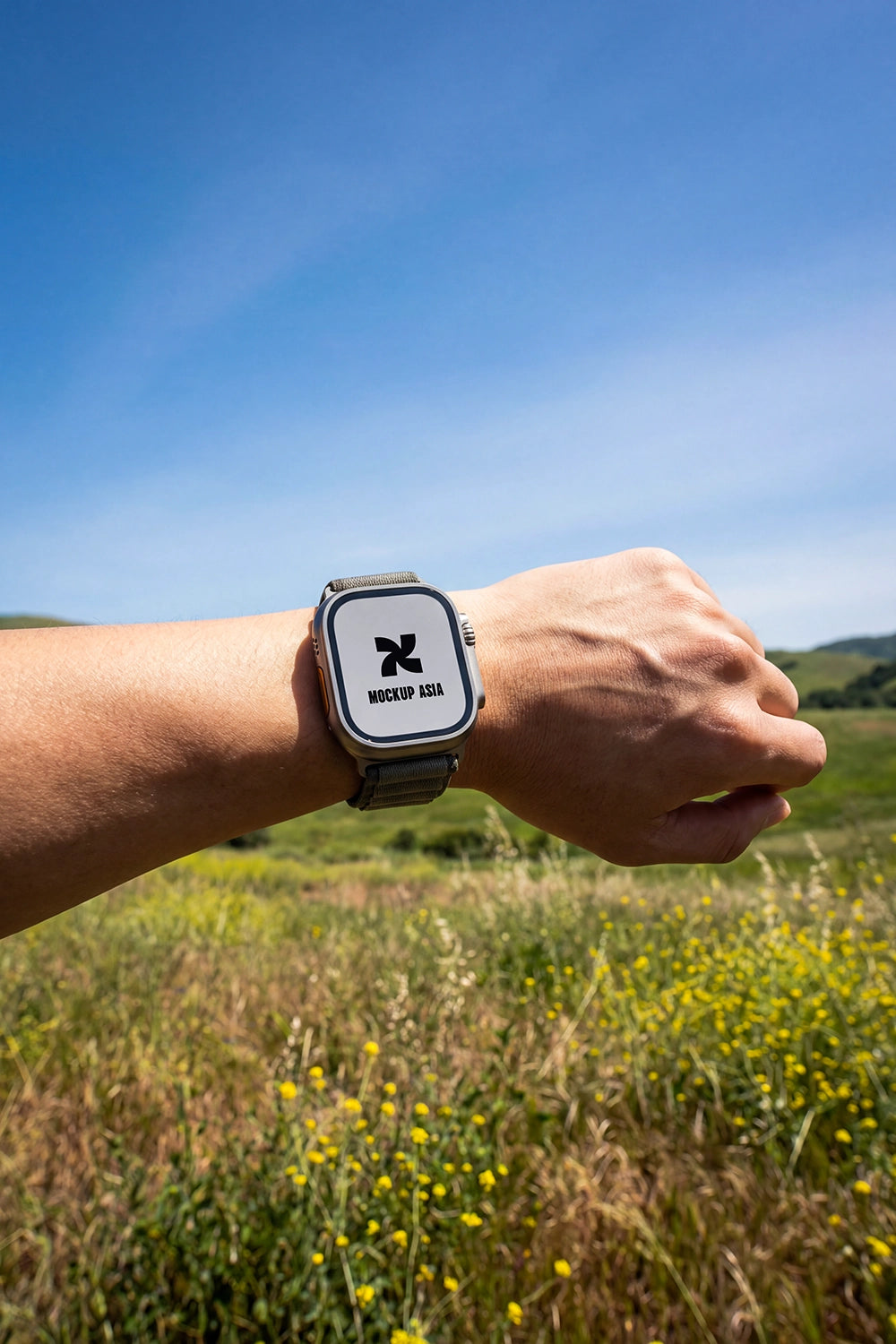 smartwatch mockup on wrist with natural sunlight and outdoor grass background
