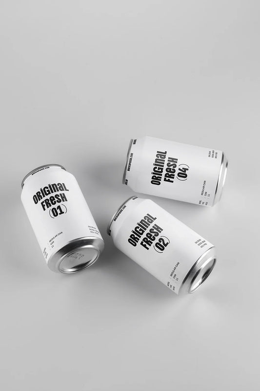 Three soda cans mockup top view scattered layout aluminum beverage packaging realistic minimal design