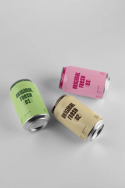 Blank drink cans mockup trio floating arrangement soft shadow clean background branding presentation template