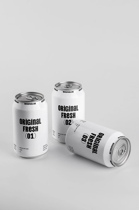 Three soda cans mockup one lying down realistic aluminum beverage packaging minimal clean background