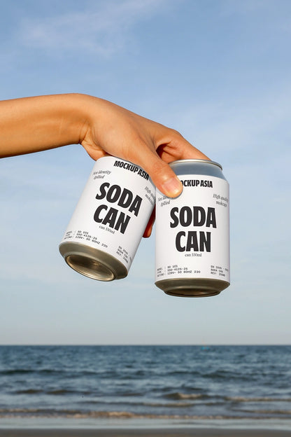 soda can mockup held in hand with two cans and beach ocean background