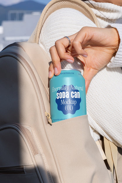 Drink can mockup being pulled from bag close up lifestyle branding natural lighting template