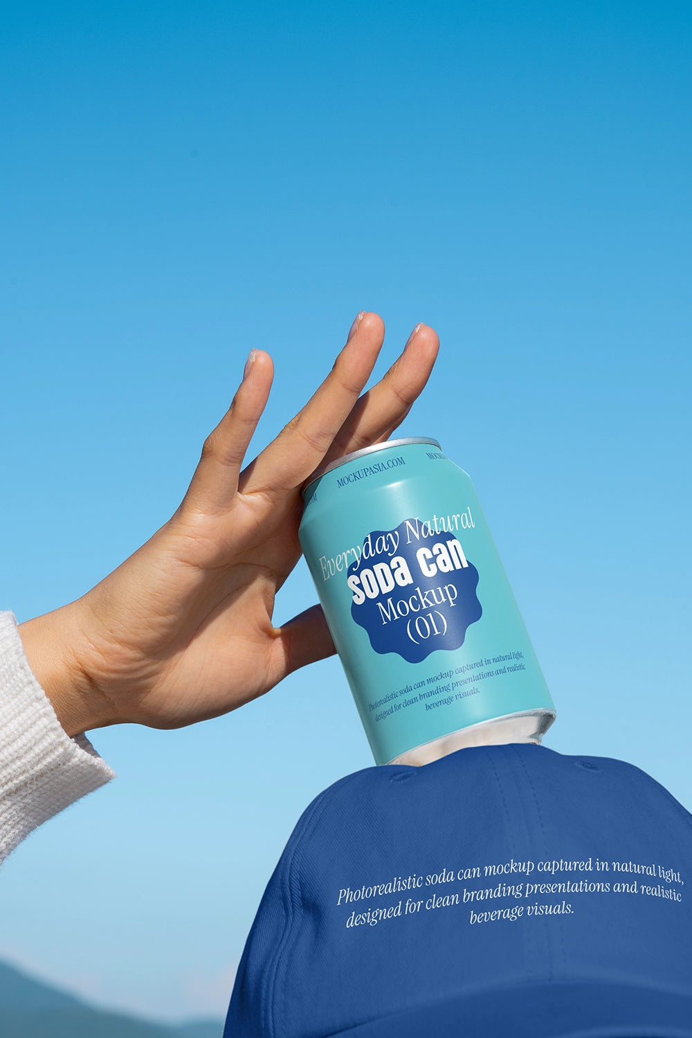 Aluminum soda can mockup handheld sky background realistic outdoor packaging PSD presentation