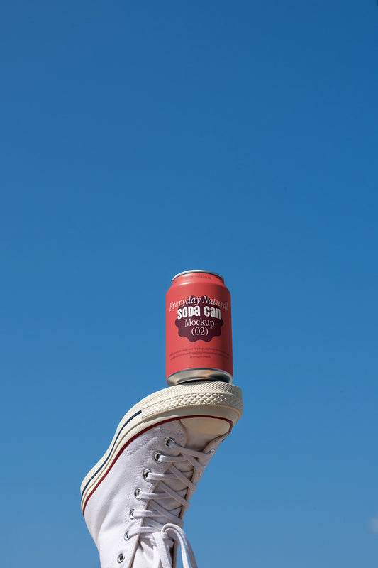 Soda can mockup balanced on sneaker outdoor sky creative lifestyle beverage packaging scene
