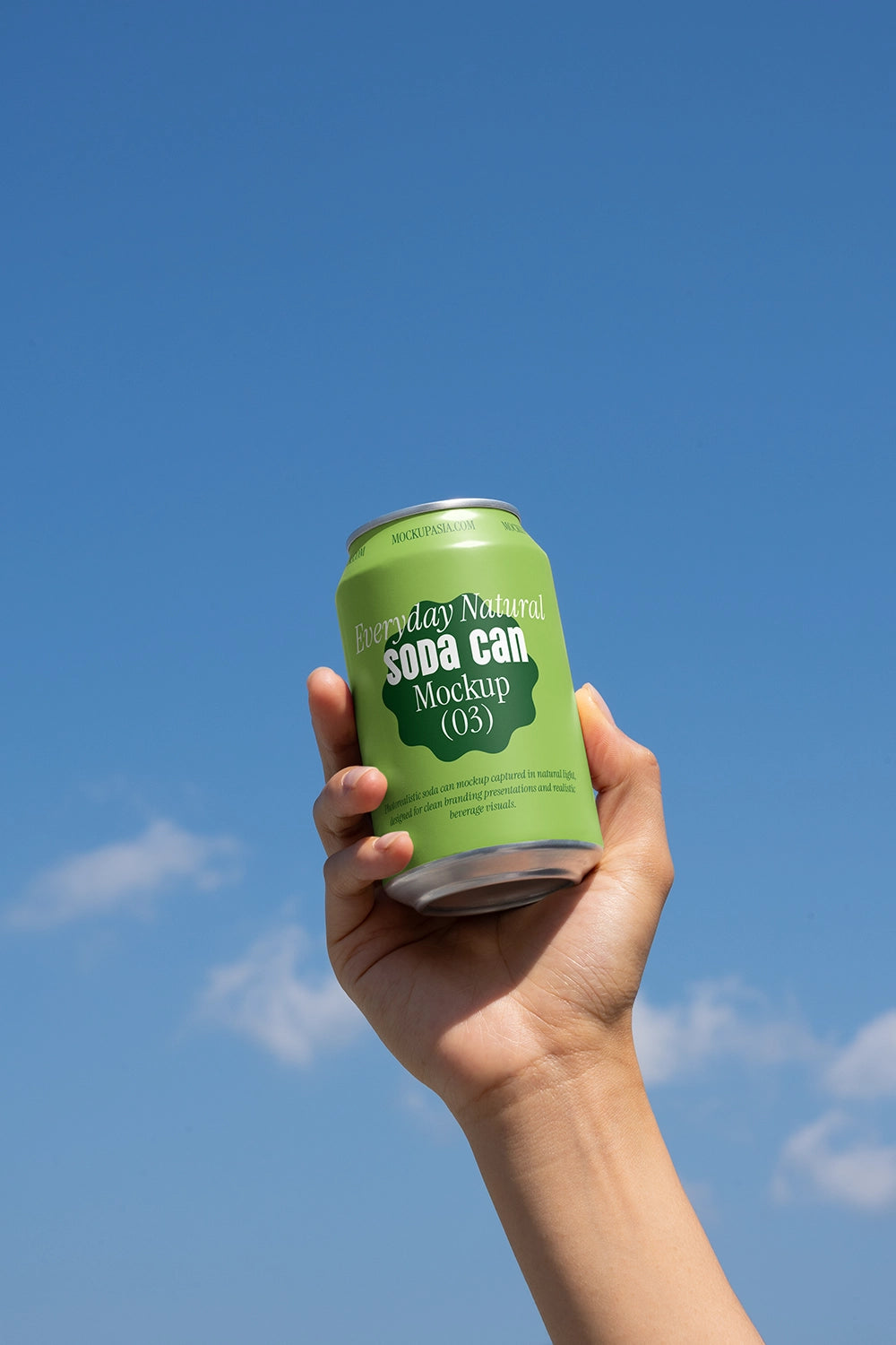 Blue drink can mockup in hand sky background natural light branding presentation template
