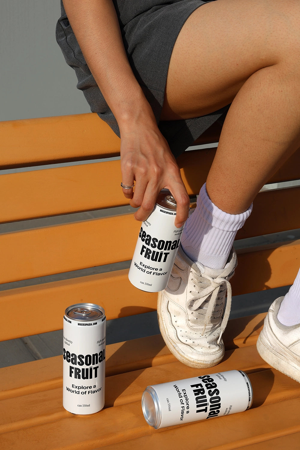 Vibrant soda can mockup with casual summer setting and natural lighting for beverage packaging design
