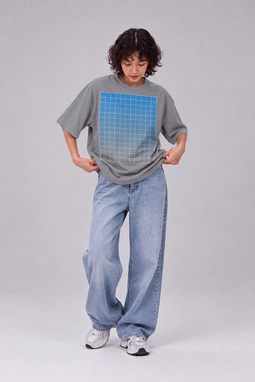 Female model wearing white T-shirt mockup with graphic design