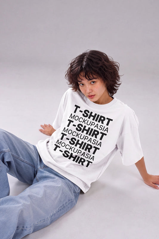 realistic oversized t-shirt mockup featuring relaxed sitting fashion model
