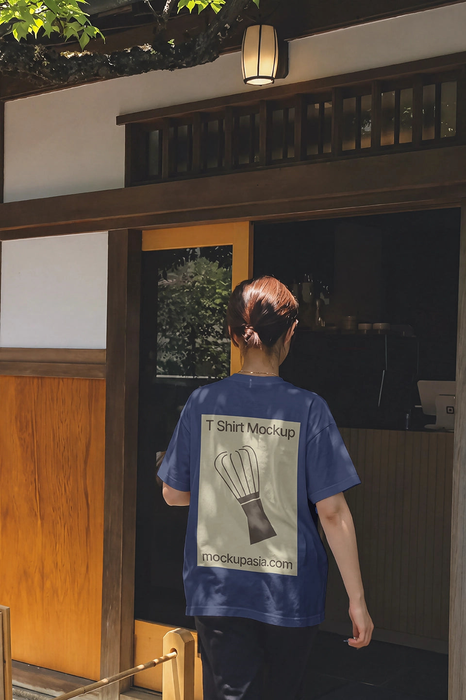 White tee back view mockup with dappled sunlight and wooden tea house