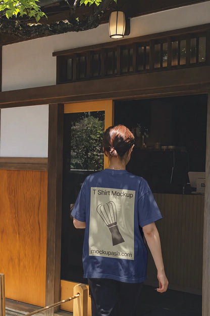 White tee back view mockup with dappled sunlight and wooden tea house