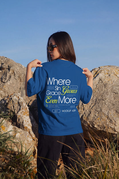 Female model holding T-shirt shoulders in sunny lifestyle mockup scene