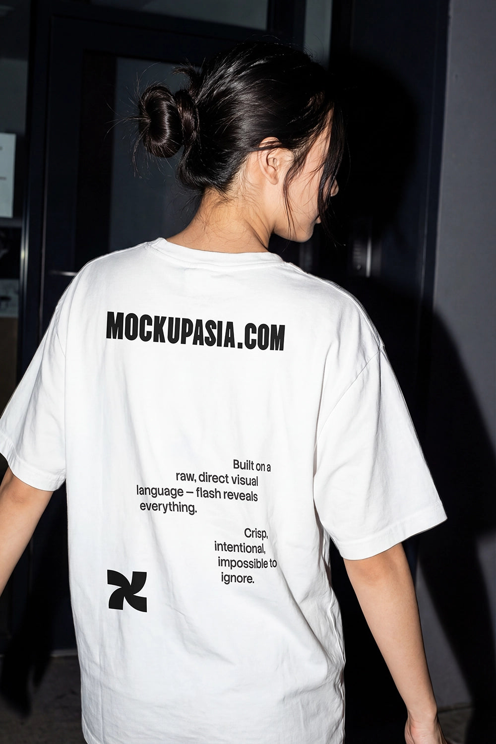 Front view of a plain white T-shirt mockup by Mockup.Asia, displayed on a flat surface with a clean background.