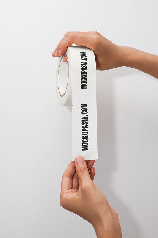 masking tape mockup held in hands with branding and minimal clean background