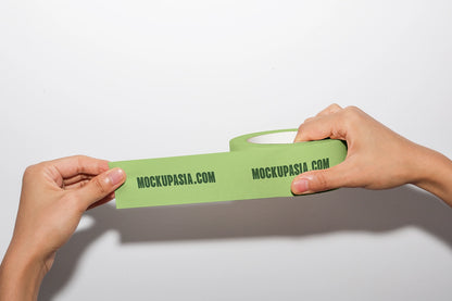 realistic adhesive tape mockup with hand interaction and horizontal strip display