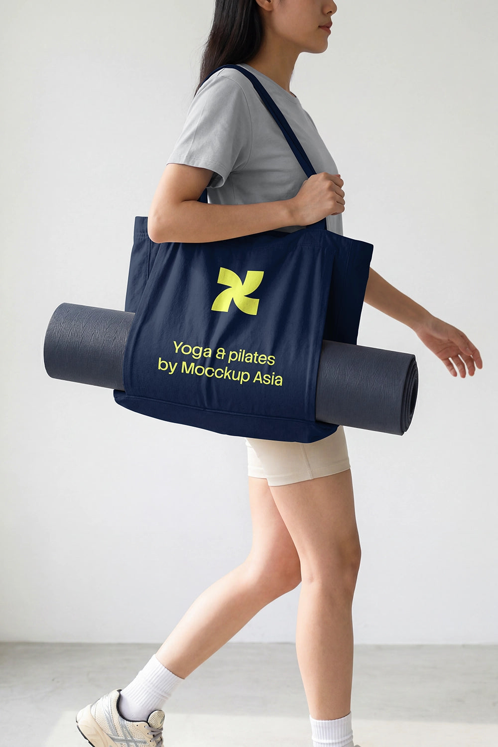 realistic tote bag mockup with yoga mat in minimal studio setting