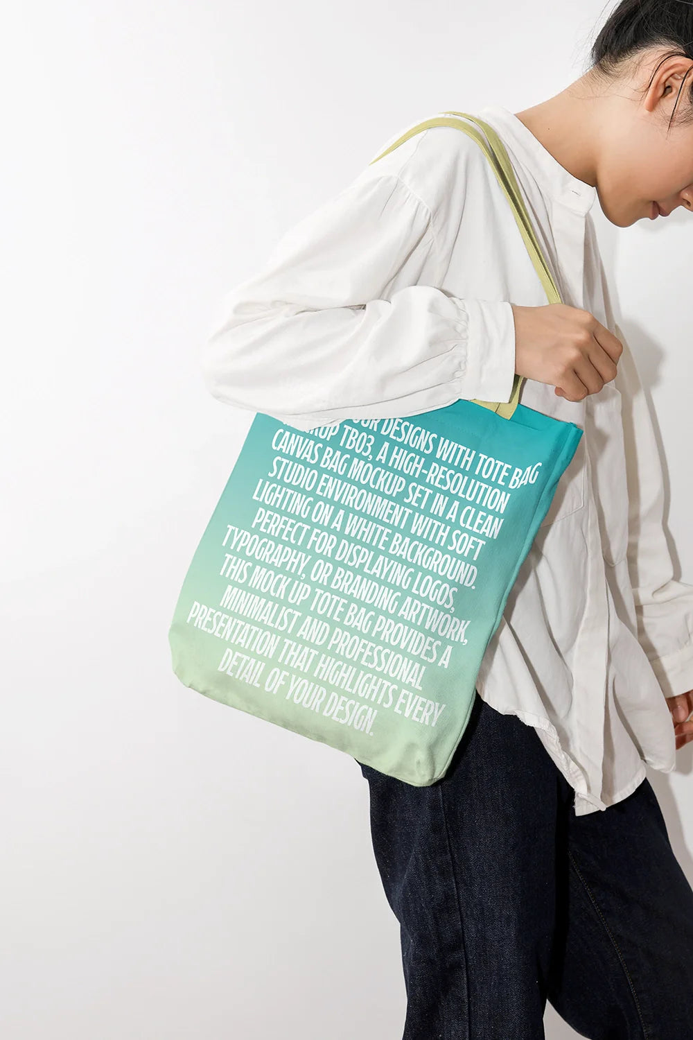 tote bag mockup worn by model with simple logo, soft lighting and neutral tones