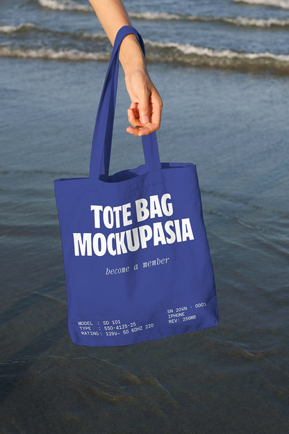 realistic canvas tote bag mockup with ocean backdrop and lifestyle presentation