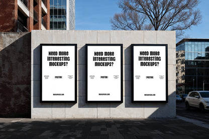 triple poster mockup on urban wall with three framed displays in outdoor street setting