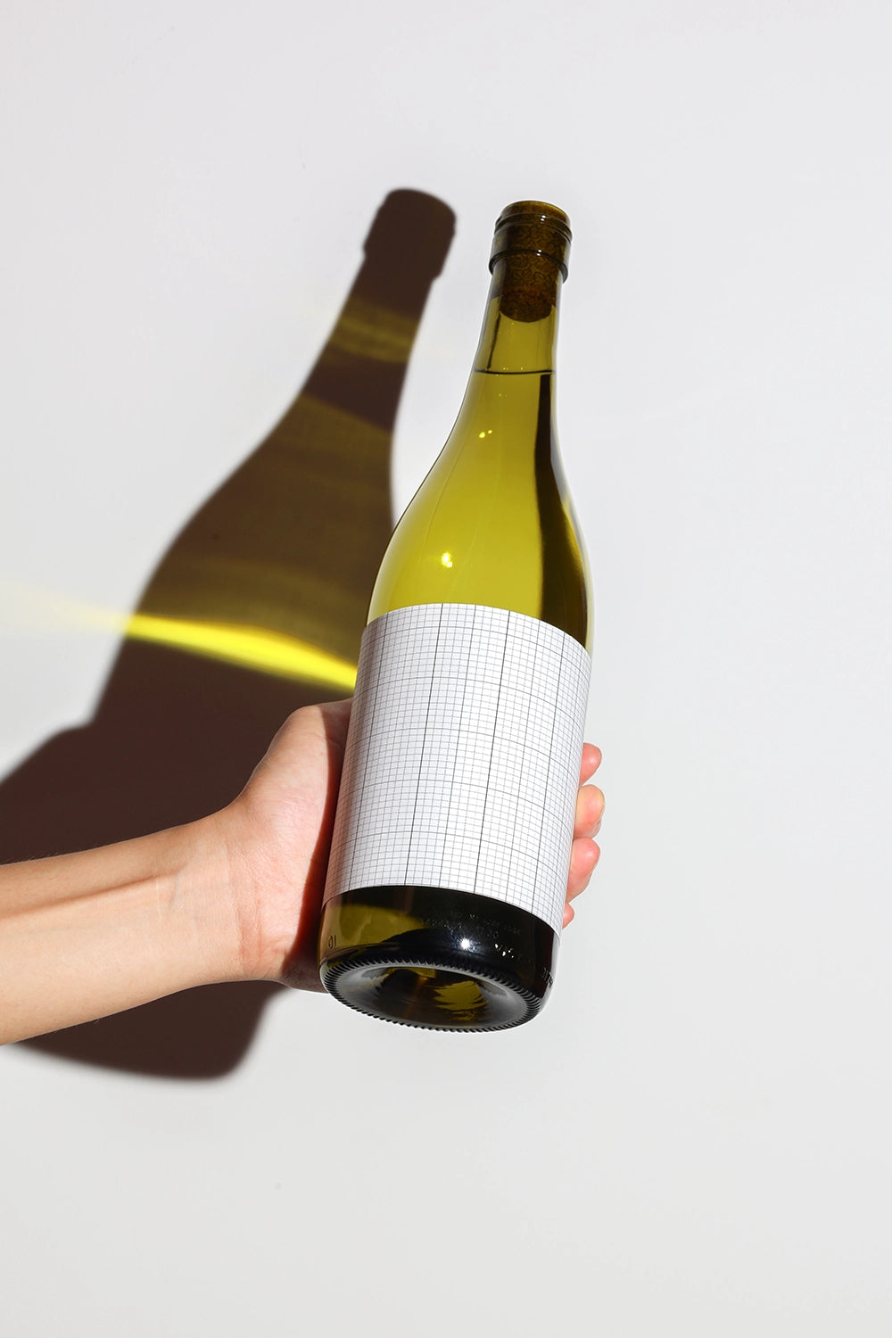 beverage bottle mockup with clean label design and shadow contrast effect