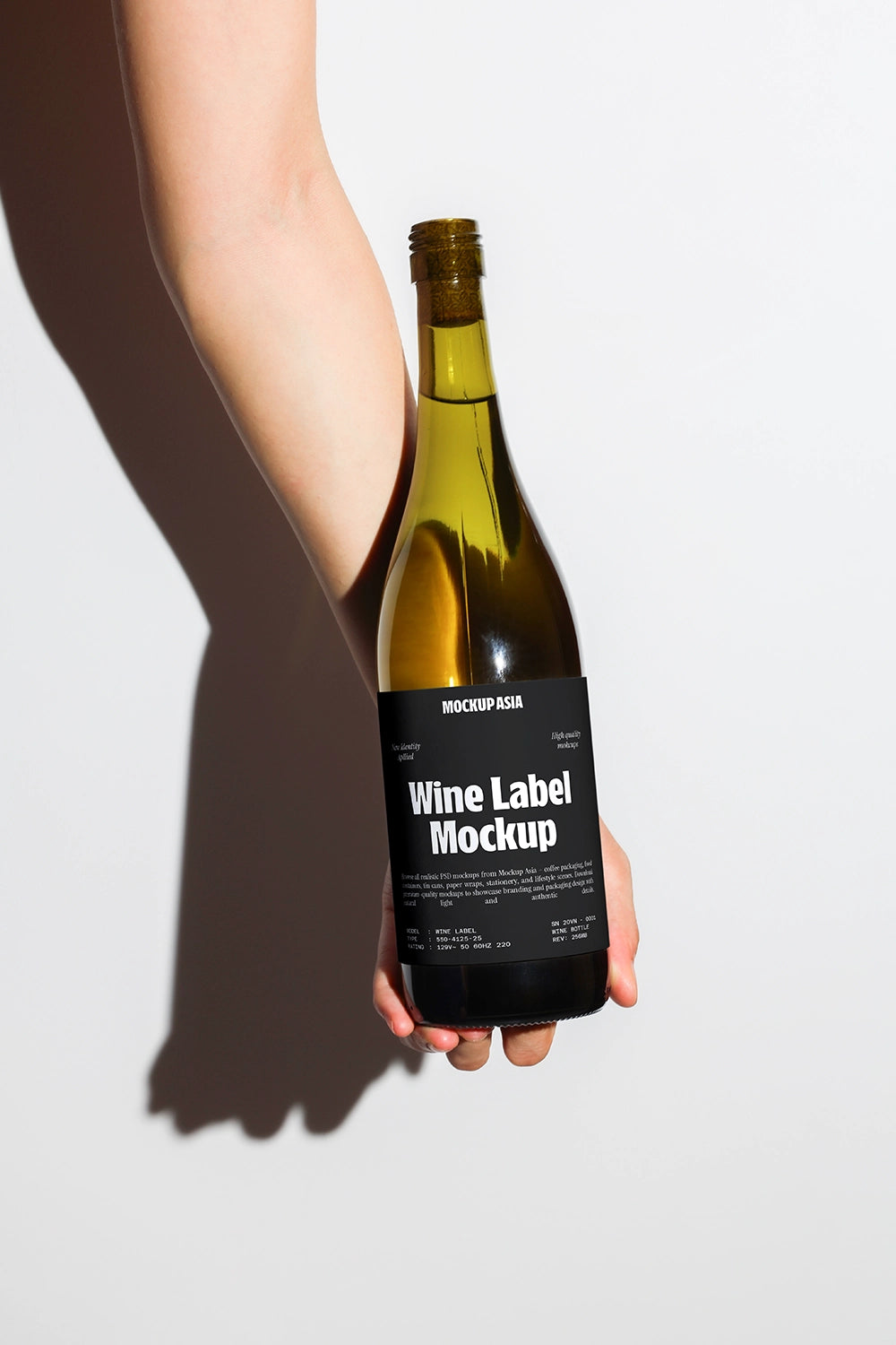 realistic wine label mockup with hand holding bottle and dramatic lighting