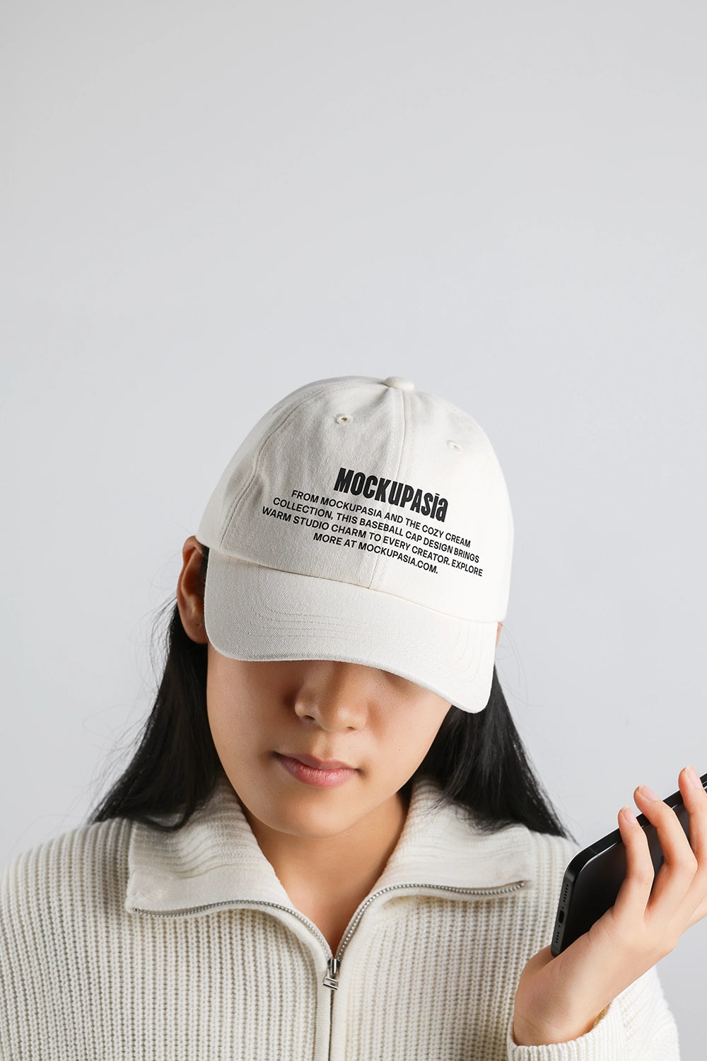 baseball cap mockup worn by person with minimal branding and clean studio background