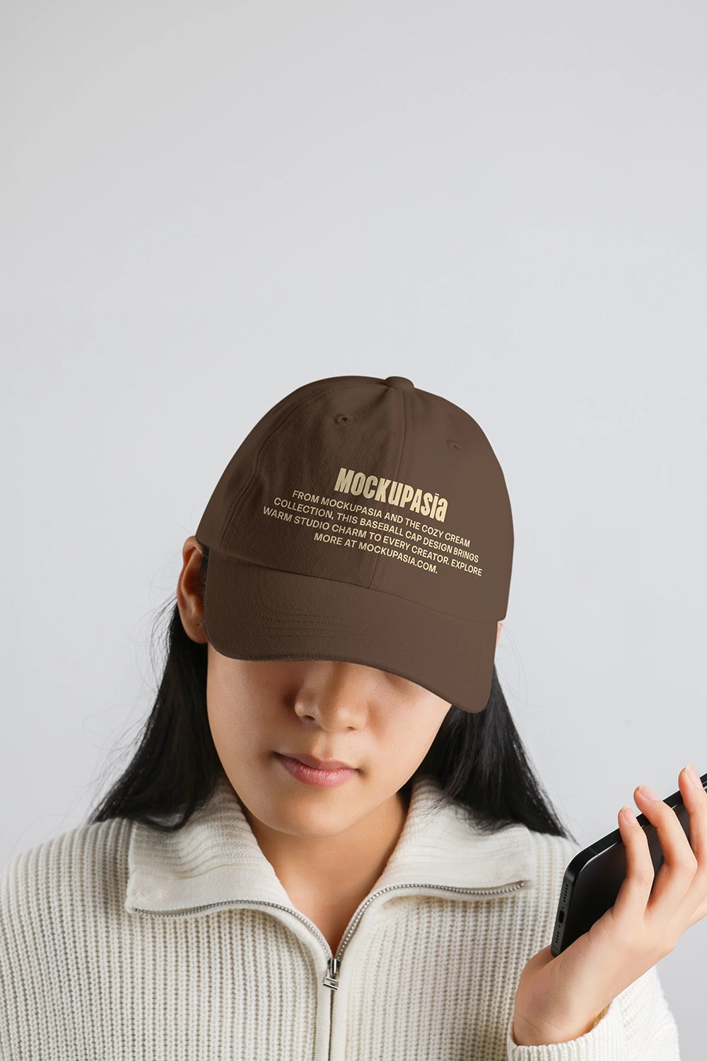realistic cap mockup on model with embroidered text and soft neutral lighting