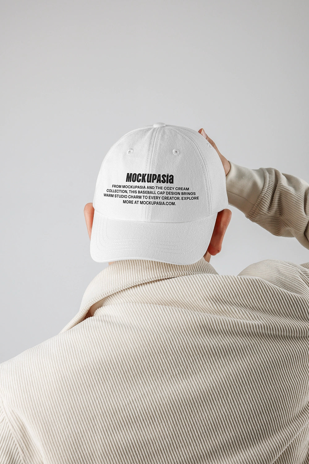 baseball cap mockup back view worn by person with minimal branding and clean background