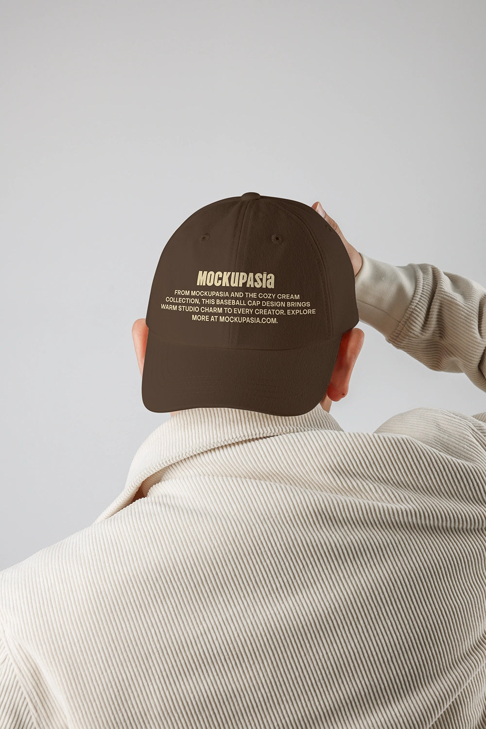 realistic cap mockup from behind with embroidered text and soft studio lighting