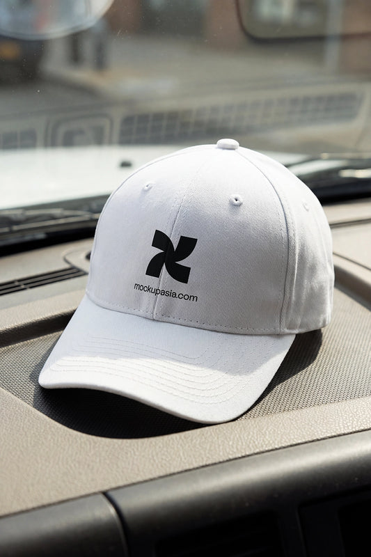 Baseball cap mockup PSD on truck dashboard for transport uniform design