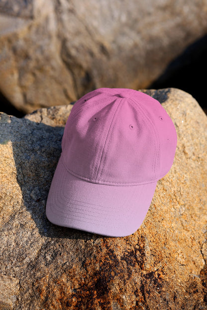 realistic cap mockup on stone background with soft natural light and fabric texture